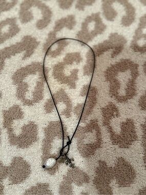 Black Cord Necklace with Pearl Charm and Fleur-de-Lis Accent